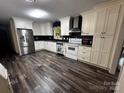 Well-lit kitchen boasts stainless steel appliances and sleek countertops at 3375 Shepherd Rd, Maiden, NC 28650
