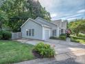 Well-maintained single-Gathering home with attached garage and landscaped front yard, showing great curb appeal at 4801 Pennant Pl, Charlotte, NC 28212