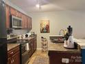 Functional kitchen featuring sleek countertops and stainless steel appliances at 9608 Brackenview Ct, Charlotte, NC 28214