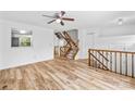 Open-concept living area with wood-look floors and lots of natural light at 9639 Green Gable Ct, Charlotte, NC 28270
