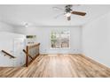 Bright living room with natural light, ceiling fan, and wood-look flooring at 9639 Green Gable Ct, Charlotte, NC 28270
