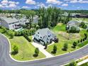 A high angle view showcasing a modern white home with a well-manicured lawn and a neatly paved driveway at 2148 Nims Village Dr, Fort Mill, SC 29715