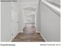 Inviting foyer with arched doorways and hardwood floors creating an elegant entrance at 217 Lake George Dr, Shelby, NC 28152