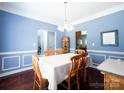 Formal dining room featuring blue walls, a white tablecloth, and wood floors at 219 Harrowfield Hts, York, SC 29745