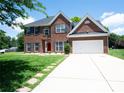 Beautiful brick home with a well-maintained lawn and concrete driveway at 219 Harrowfield Hts, York, SC 29745
