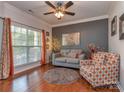 Cozy living room with hardwood floors, natural light, and stylish furnishings at 3511 Dominion Green Dr, Charlotte, NC 28269