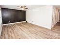 Spacious living room featuring hardwood floors and ample natural light at 506 Broadway Ct, Statesville, NC 28677