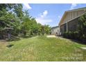 Expansive backyard with manicured lawn and a privacy fence, perfect for outdoor activities at 5524 Elk Knob Ct, Denver, NC 28037