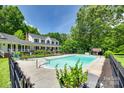 Inviting swimming pool surrounded by lush greenery, ideal for summer fun and relaxation at 675 Ormand Rd, York, SC 29745