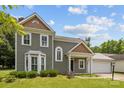 Attractive two-story home featuring a well-maintained lawn, neatly trimmed bushes, and a two car garage at 9121 Four Acre Ct, Charlotte, NC 28210