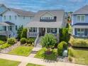 Inviting home featuring a charming front porch, landscaped garden, and well-kept lawn at 956 Herrons Ferry Rd, Rock Hill, SC 29730