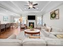 Inviting living room with a fireplace, neutral decor, and open layout leading to the dining area at 117 Autumn Mist Rd, Statesville, NC 28677