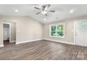 Bright living room featuring hardwood floors, neutral paint, and a ceiling fan at 1234 Goodnight Ln, Kannapolis, NC 28081