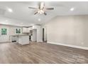 Open concept living space with hardwood floors, opening to the kitchen and dining area at 1234 Goodnight Ln, Kannapolis, NC 28081