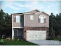 Charming two-story home featuring a two-car garage, gray siding, and brick accents in a well-manicured community at 1326 31St Ne St, Conover, NC 28613