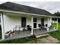 Charming front porch with a mix of seating options, perfect for relaxing outdoors at 211 Oak Dr, Shelby, NC 28150