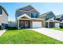 Traditional two-story home with stone accents, well-manicured lawn and ample parking at 2526 Snow Creek Ne Rd, Hickory, NC 28601