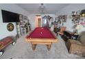 Spacious game room featuring a pool table, wet bar, and TV at 284 Old Harbor Dr, Mount Gilead, NC 27306