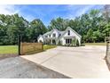 Beautiful exterior featuring a gated entrance and well-manicured lawn at 440 Bridlewood Dr, Gold Hill, NC 28071