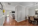 A welcoming hallway leading to the living room and dining area at 4408 Overbecks Ln, Waxhaw, NC 28173
