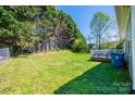 Expansive backyard featuring lush green grass and a private deck area, great for outdoor enjoyment at 50 Serenity Ln, Hickory, NC 28601