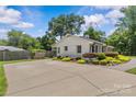 Ranch style home with large parking pad and well manicured landscaping at 5501 Murrayhill Rd, Charlotte, NC 28210
