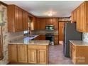 Traditional kitchen featuring wood cabinets, granite countertops and stainless steel appliances at 6632 Summer Darby Ln, Charlotte, NC 28270