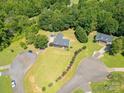Expansive aerial view of a home with a sprawling yard, showcasing its prime location within a lush community at 814 Carved Oak Ct, York, SC 29745