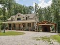 Spacious home with a covered porch and a convenient covered carport at 820 King Rd, Clover, SC 29710