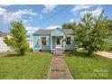 Inviting home with blue siding, white trim, and a neatly landscaped front yard at 1019 Richard St, Salisbury, NC 28144