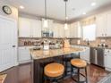Bright kitchen with a central island, stainless steel appliances, and granite countertops at 1109 Saratoga Blvd, Indian Trail, NC 28079