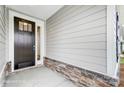 Inviting entrance with a stylish front door, decorative stone accents, and neutral siding at 1425 Ardmore Dr # 247, Sherrills Ford, NC 28673