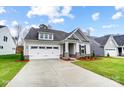 Beautifully designed single-story home with a two-car garage, neat landscaping, and covered entrance at 1425 Ardmore Dr # 247, Sherrills Ford, NC 28673