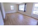 Bright living room with pristine hardwood floors and ample natural light from large windows at 1926 Eastway Dr, Charlotte, NC 28205