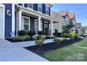 Inviting front entrance featuring manicured landscaping, a well-maintained lawn, and a welcoming walkway at 235 Boxelder Rd, Clover, SC 29710