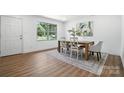Bright dining area with stylish wood table and chairs, decorative rug, and ample natural light at 2705 Lowell Bethesda Rd, Gastonia, NC 28056