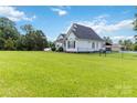 Side view showcasing the home's fenced-in yard, offering privacy and security at 3624 Ramsey Rd, Sharon, SC 29742