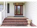 Inviting front entrance featuring a decorative glass door and brick steps at 3624 Ramsey Rd, Sharon, SC 29742