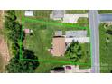 Aerial view of property showcasing lot size with well-maintained lawn, home, and outdoor gazebo at 3651 16Th Ne St, Hickory, NC 28601