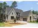 A beautiful two-story house with a gray roof, complementing the exterior paint and brickwork for a classic look at 4069 Rivendell Rd, Denver, NC 28037