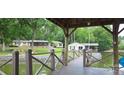 Lakeside property view from dock, featuring lush lawn, and waterfront access for outdoor enjoyment at 4485 River Oaks Rd, Lake Wylie, SC 29710