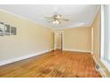 Bright living room featuring hardwood floors, a ceiling fan, and ample natural light at 4555 Us 601 Hwy, Salisbury, NC 28147