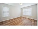 Bright bedroom featuring wood floors and large windows with natural light at 5375 Eneida Sue Dr, Charlotte, NC 28214