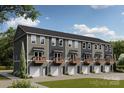 Townhome showcasing garages, balconies, and beautiful outdoor landscaping at 542 Beatties Ford Rd, Charlotte, NC 28216