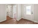 Welcoming entryway featuring wood-look flooring and a view of the bathroom and bedroom at 7106 Jerimoth Dr, Charlotte, NC 28215