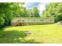 Spacious backyard with well-kept lawn and mature trees provides ample privacy and a peaceful setting at 812 Acclaim Dr, York, SC 29745