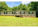 Charming single-story home featuring neutral siding, a welcoming front porch, and a lush green lawn at 812 Acclaim Dr, York, SC 29745