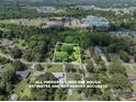 Drone shot displays the property lines among lush trees and surrounding neighborhood at 2008 Kimway Dr, Matthews, NC 28105