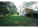 Spacious backyard featuring a screened porch, perfect for outdoor relaxation and enjoying nature at 2087 Poinsett Dr, Rock Hill, SC 29732