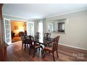 Formal dining room featuring wood floors, mirror accent, and French doors leading to the living area at 2087 Poinsett Dr, Rock Hill, SC 29732